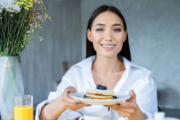 Portrait Smiling Asian Woman Pancakes Served Blueberries Plate Hands Home — стоковое фото
