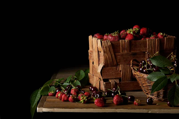 Freshly Harvested Cherries Strawberries Wooden Tabletop Black — стоковое фото