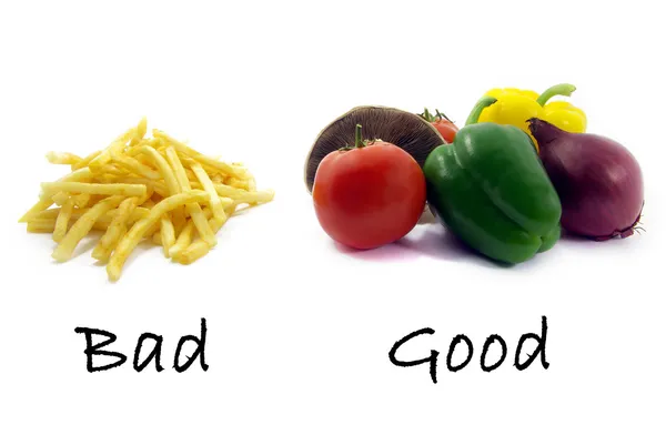 Хорошая здоровая пища, плохо нездоровые пищевые красители — стоковое фото